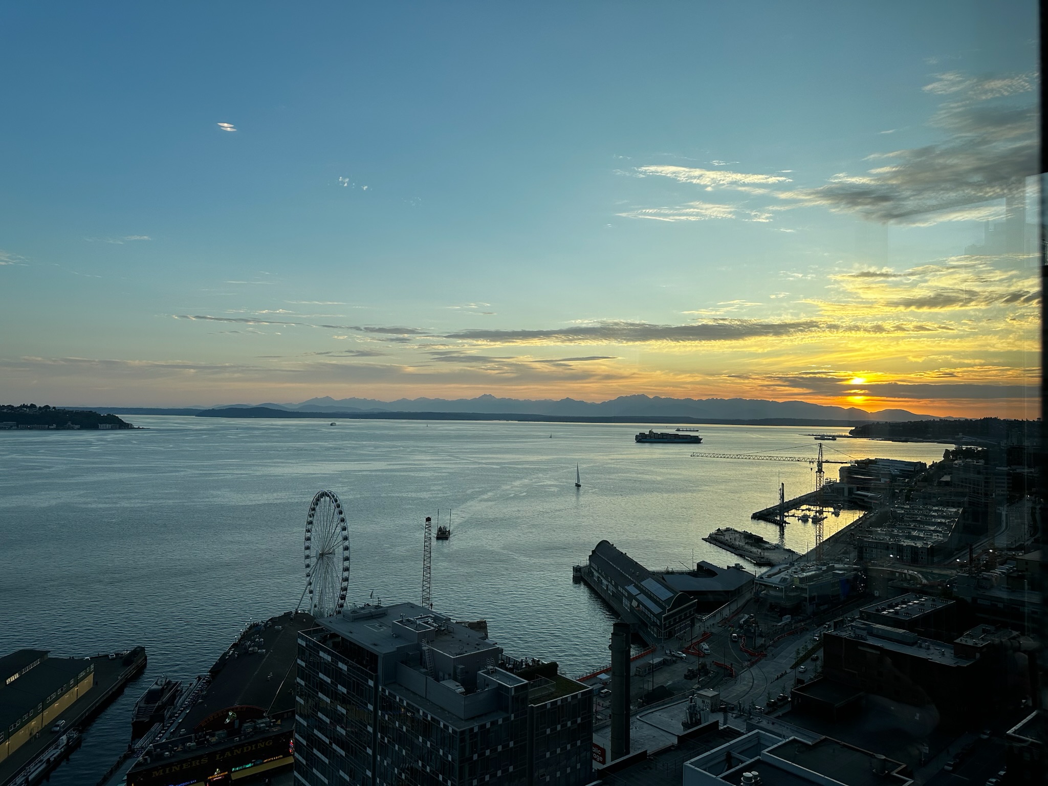 An overview looking west over the Puget Sound at a blue to red sunset.
